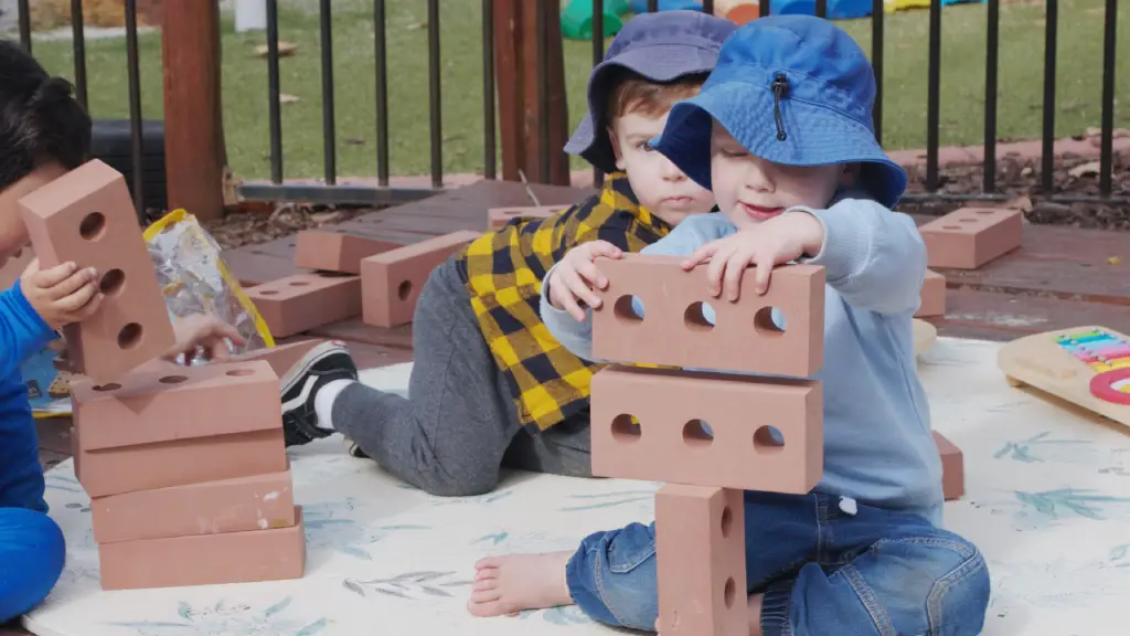 child playing with bricks